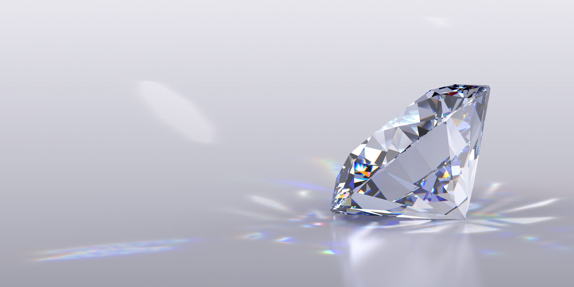 Round cut diamond on gray glossy background